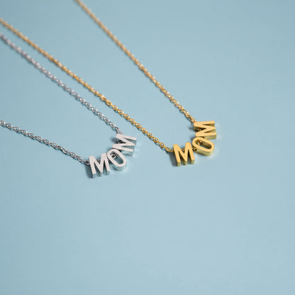 Two necklaces with 'MOM' pendants on a blue background